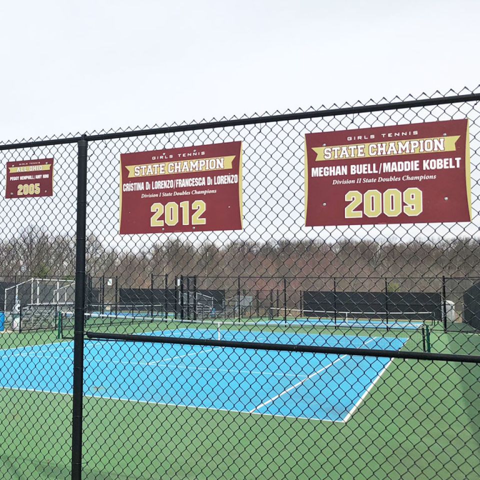 tennis championship banners on fence
