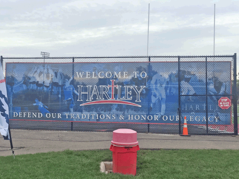Bishop Hartley printed mesh fence banner with student photos
