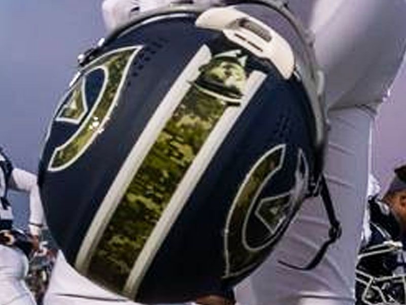 upside down player helmet with veteran picture stripe