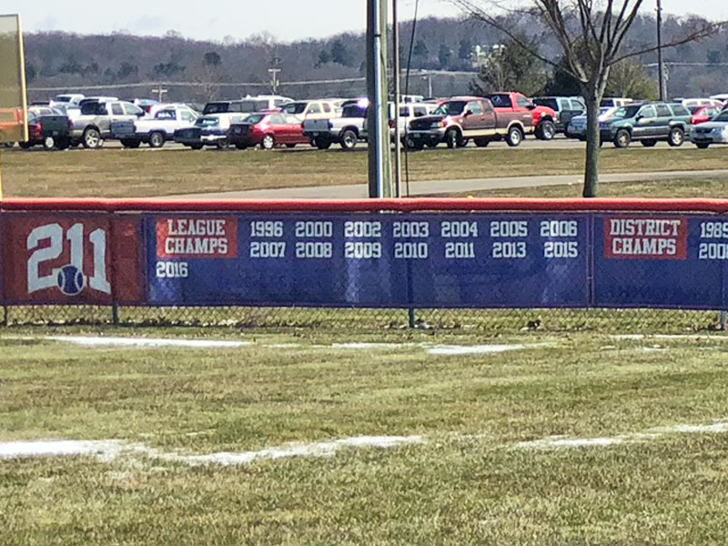 mesh baseball field banner with printed championships and distance