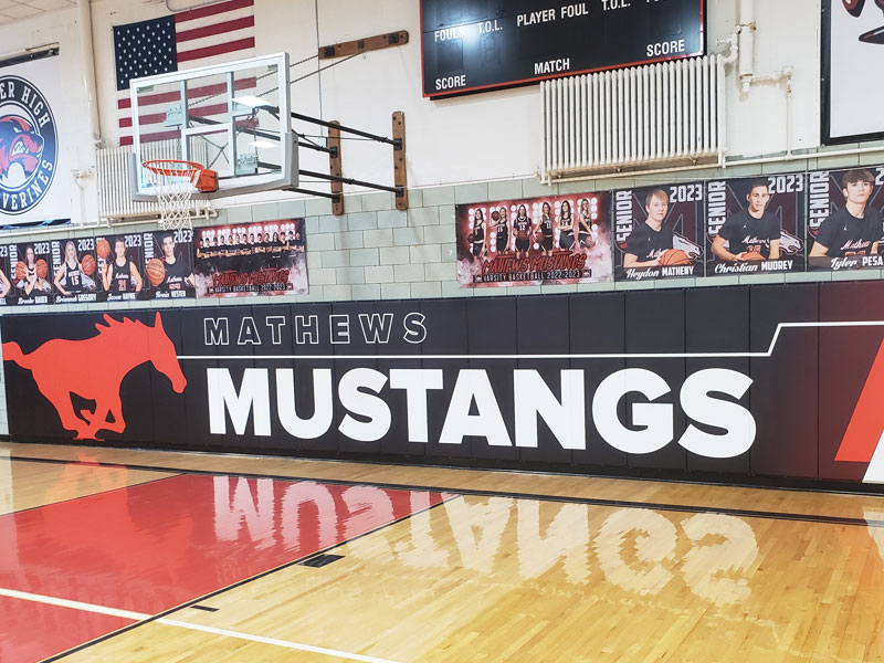 Mathews Mustangs wall pads installed under the basket