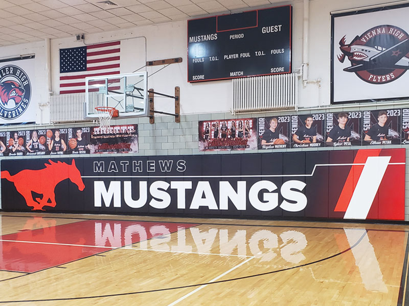 custom printed wall pads installed in gymnasium