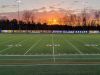 walnut hills high school mesh fence banner at sunset