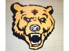 power grip mascot on block wall