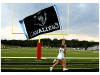 Cavaliers field runner flag with cheerleaders
