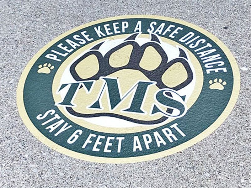 power grip covid graphics on pavement