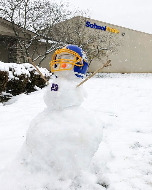Snowman wearing a SchoolPride&reg; football helmet in from of the School Pride Ltd building at 3511 Johnny Appleseed Ct, Columbus Ohio