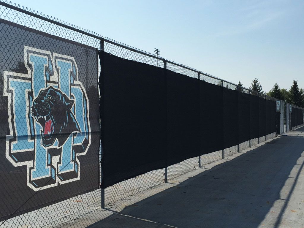 black wind screen banner on fence with printed mesh section