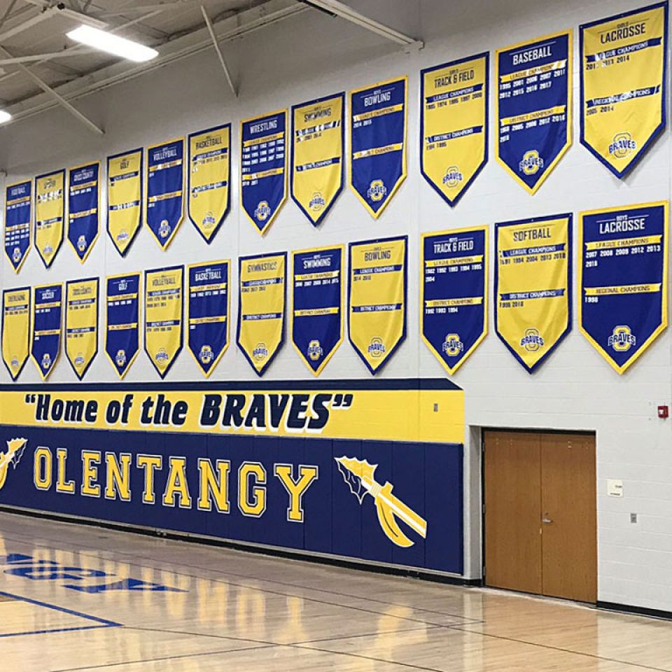 Olentangy Braves add a year banners in gym