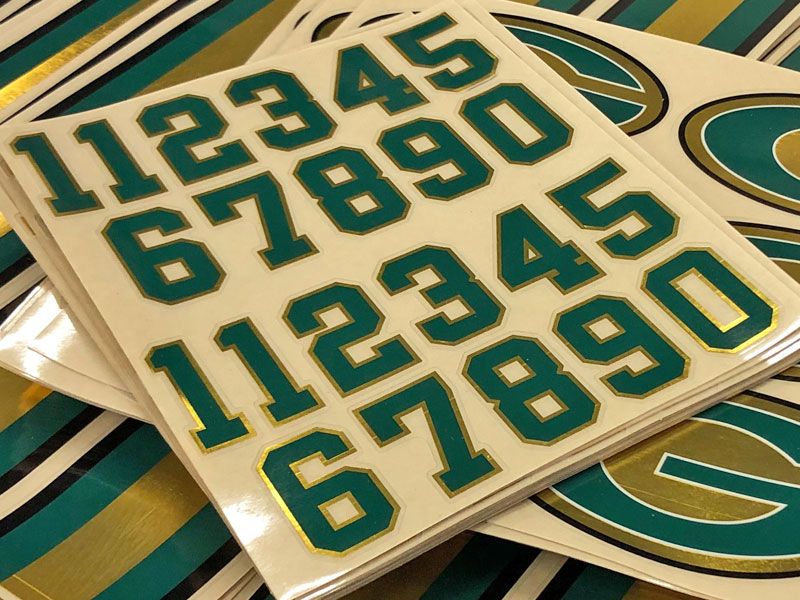 green and athletic gold chrome punch out numbers decals and stripes