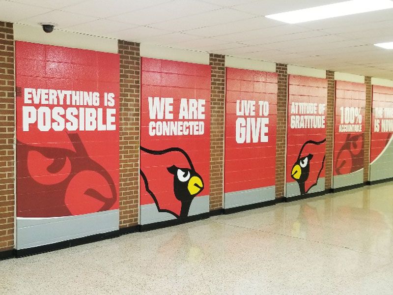 wall wrapped hall way with school mascot